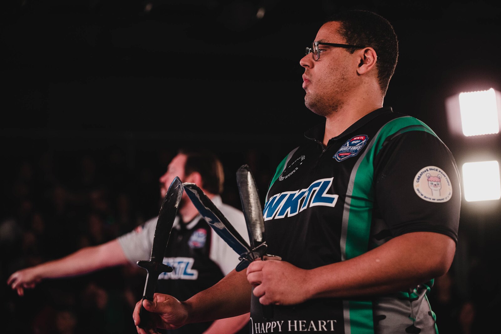 A WKTL competitor holding throwing knives before a match