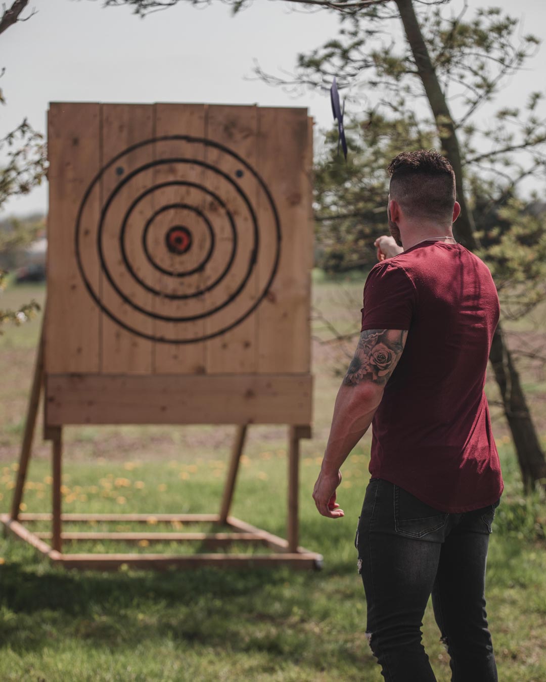 A thrower practising at a home-built regulation target outdoors