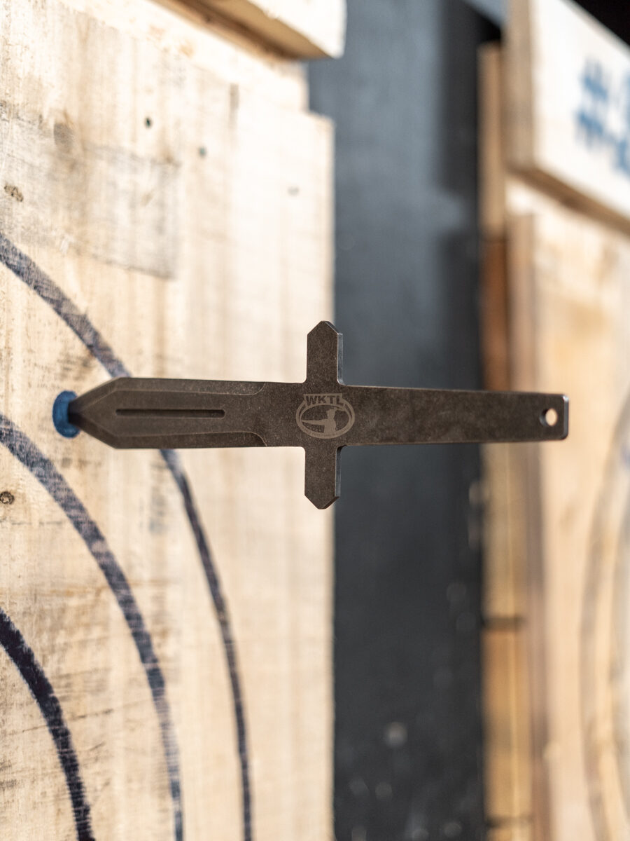 A WKTL competition knife embedded in a target board