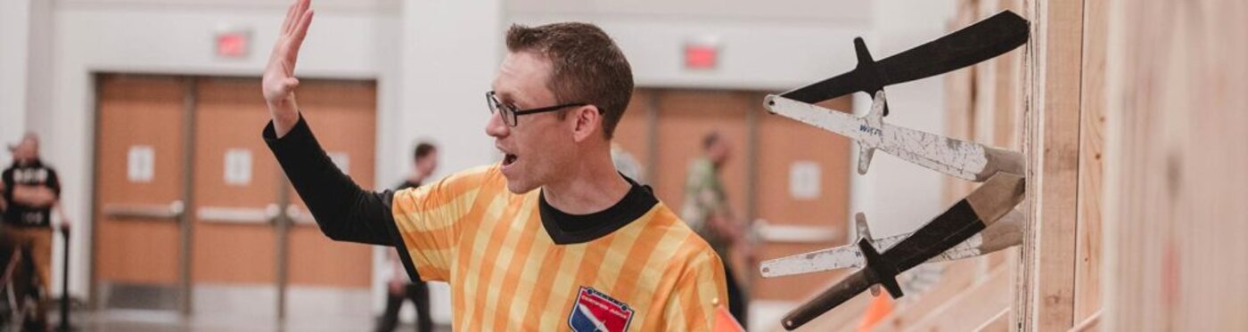 A WKTL league official at the target during a league night
