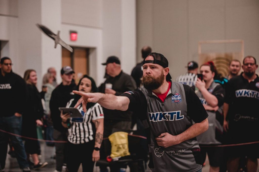 An image of a person throwing a knife